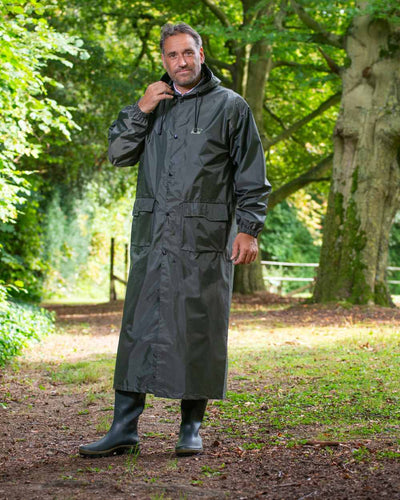 Green Khaki Coloured Baleno Montana Long Raincoat On A Stable Background #colour_green-khaki