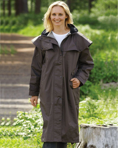 Brown Coloured Champion Sandringham Long Waterproof Coat On A Forest Background #colour_brown