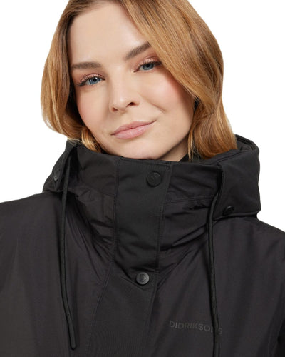 Black Coloured Didriksons Womens Elissa Parka On A White Background #colour_black