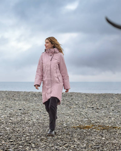 Oyster Lilac Coloured Didriksons Womens Elissa Parka On A Coastal Background #colour_oyster-lilac