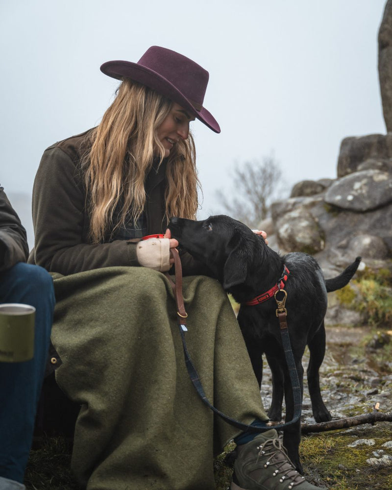 Merlot Coloured Hoggs Of Fife Perth Crushable Felt Hat On model with mountain Background 