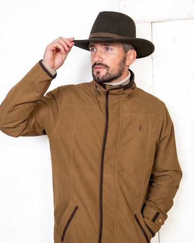 Brown coloured Jack Murphy Boston Crushable Felt Hat on wall background #colour_brown