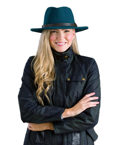 Teal Green coloured Jack Murphy Boston Crushable Felt Hat on wall background #colour_teal-green