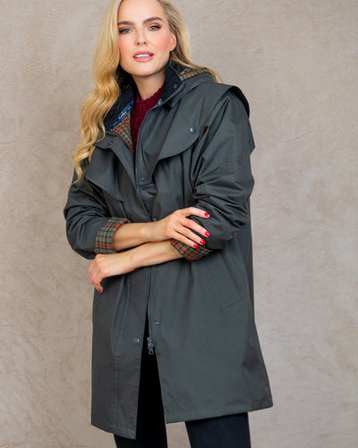 Olive coloured Jack Murphy Cotswold Ladies Waterproof 3/4 Coat on wall background #colour_olive