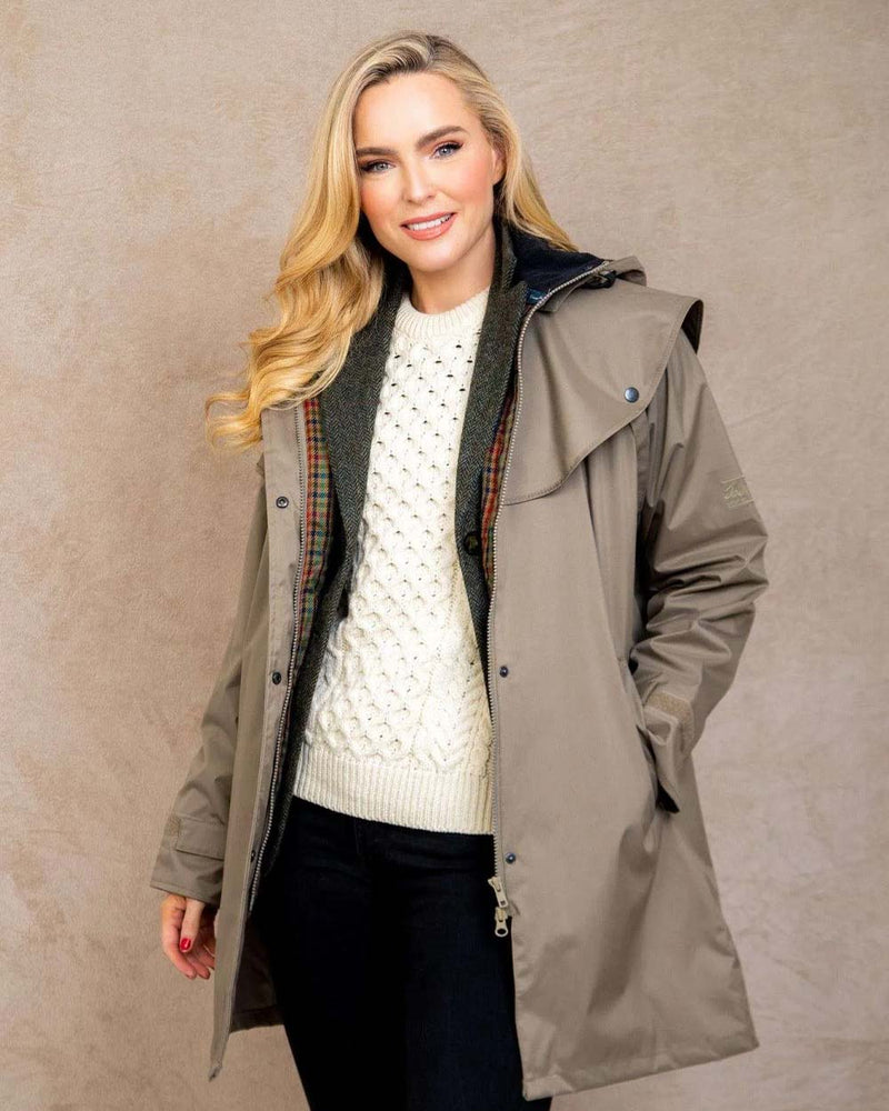 Chincilla coloured Jack Murphy Cotswold Ladies Waterproof 3/4 Coat on Wall background 