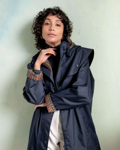 Heritage Navy coloured Jack Murphy Cotswold Ladies Waterproof 3/4 Coat on wall background #colour_heritage-navy