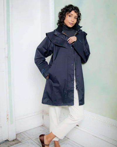 Heritage Navy coloured Jack Murphy Cotswold Ladies Waterproof 3/4 Coat on wall background #colour_heritage-navy