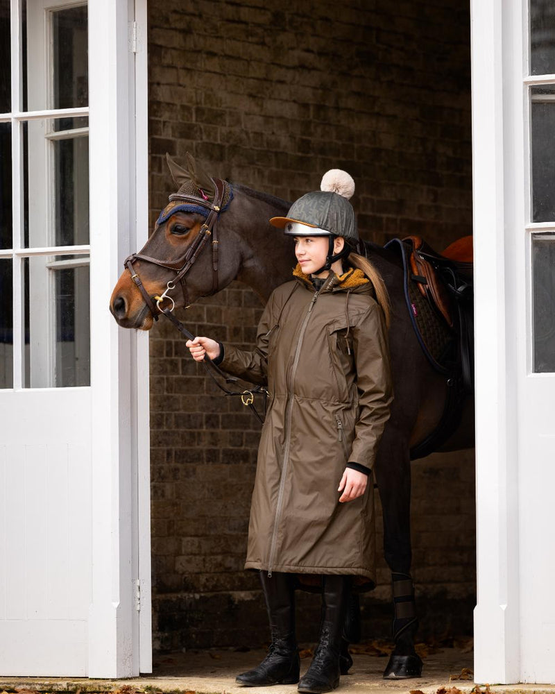 Alpine Coloured LeMieux Elements Coat On A Stable Background 