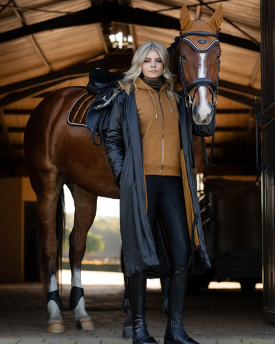 Navy Coloured LeMieux Elements Coat On A Stable Background #colour_navy