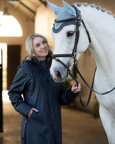 Navy Coloured LeMieux Elements Coat On A Stable Background #colour_navy